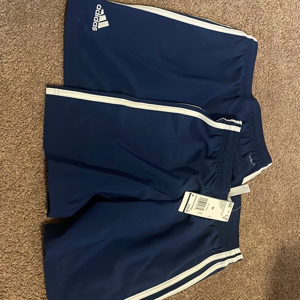 2 pairs of blue adidas shorts